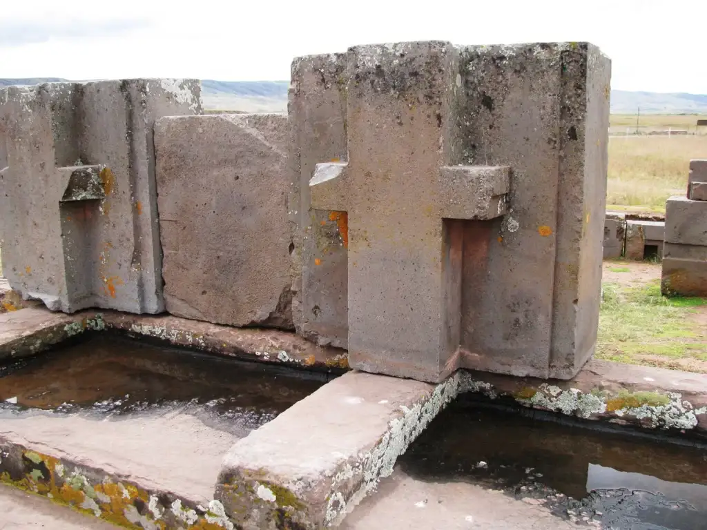 Massive stone blocks at Puma Punku with complex geometric grooves and cuts designed for interlocking without the use of mortar