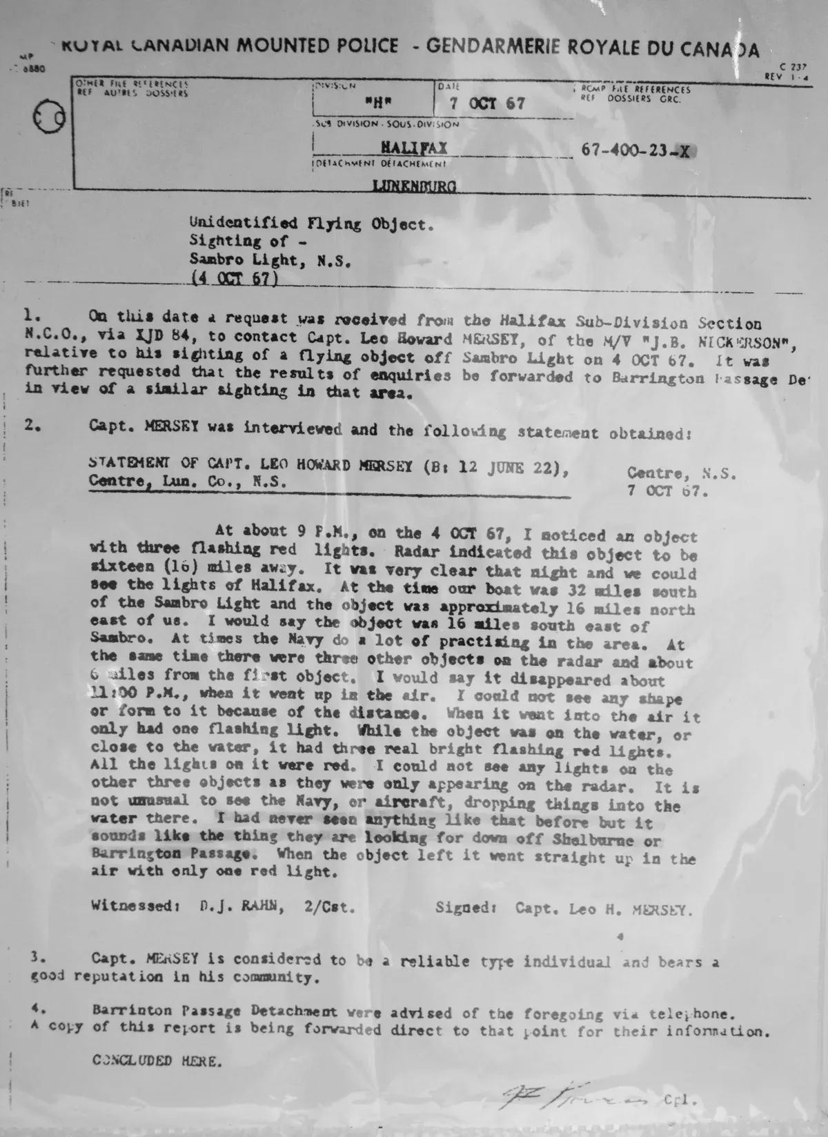 Scanned page of a typewritten police document with a letterhead and a signature at the bottom
